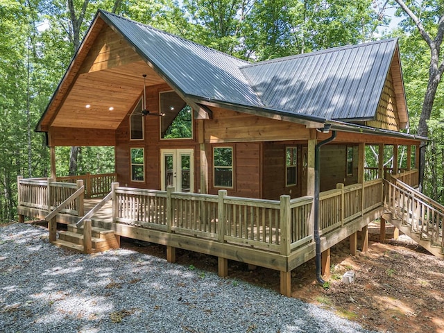 rear view of house featuring a deck