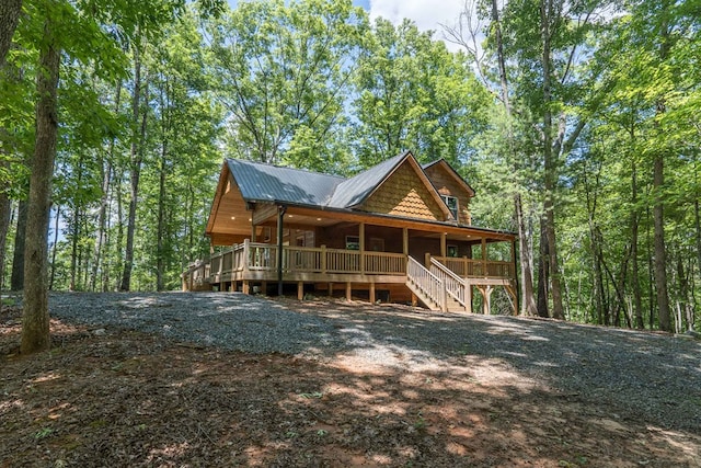 back of house with a wooden deck