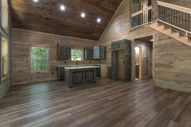 kitchen featuring a center island, wooden walls, wooden ceiling, high vaulted ceiling, and dark hardwood / wood-style floors