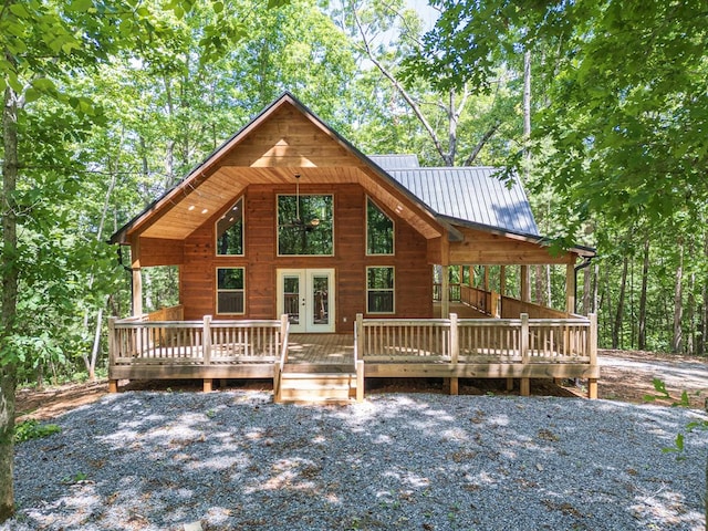 exterior space with a wooden deck and french doors