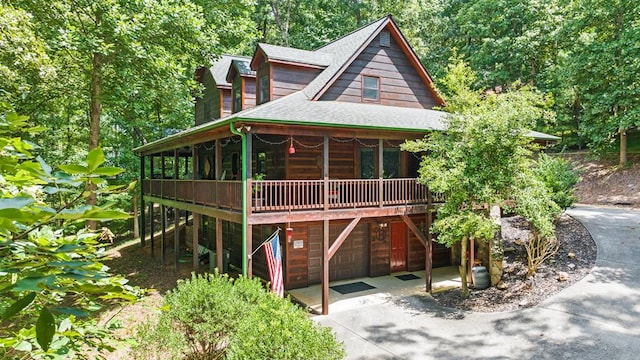 264 Summit St, Ellijay, GA 30540 - view of front of house featuring a garage, roof with shingles, and concrete driveway