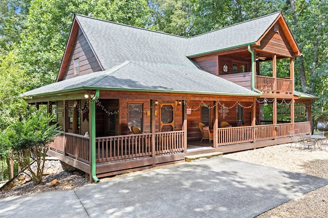 264 Summit St, Ellijay, GA 30540 - rustic home with roof with shingles, a porch, and a ceiling fan