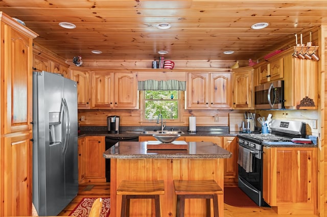 264 Summit St, Ellijay, GA 30540 - kitchen featuring appliances with stainless steel finishes, a sink, light wood-style flooring, recessed lighting, and dark stone countertops