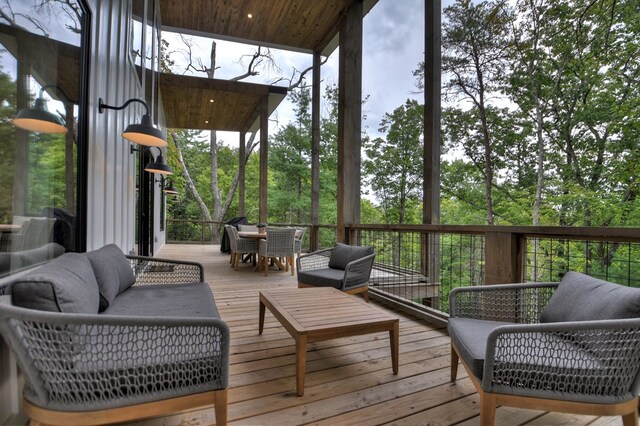 wooden deck with an outdoor living space