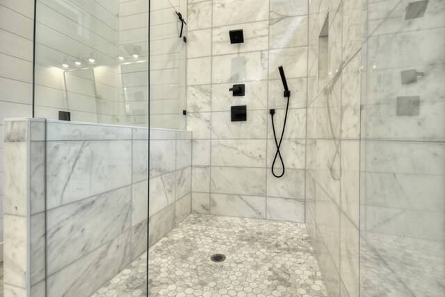 bathroom with a tile shower