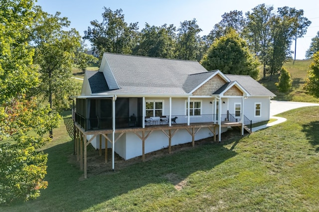 21 Hogue Way, Blairsville, GA 30512 - back of property featuring a lawn, a shingled roof, and a sunroom