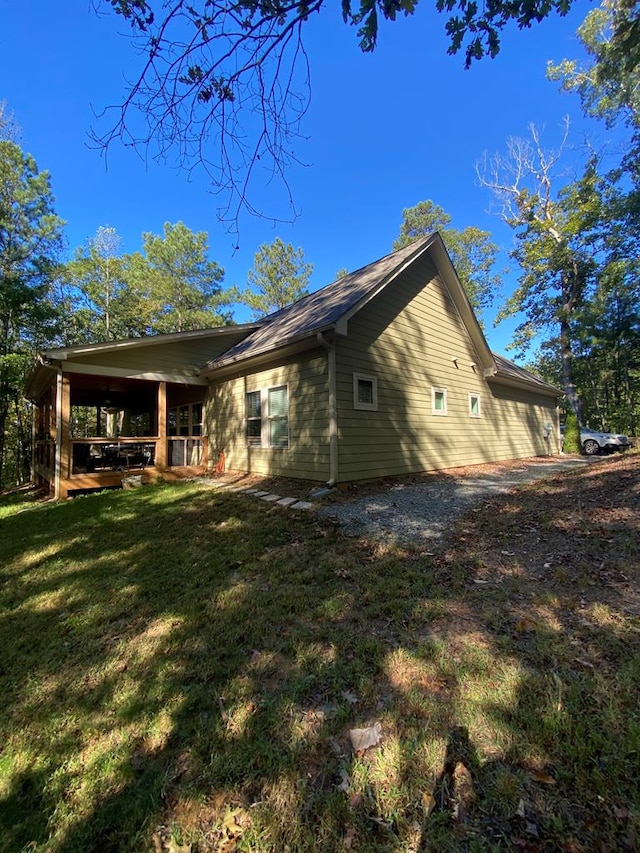 view of property exterior featuring a lawn