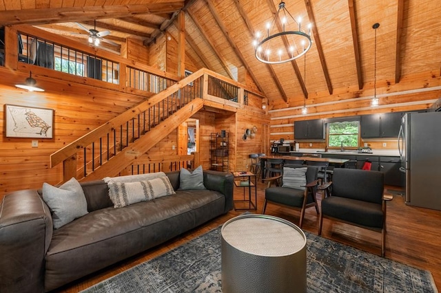 421 Weeks Creek Rd, Blue Ridge, GA 30513 - living room featuring wooden walls, wooden ceiling with exposed beams, wood finished floors, stairs, and a chandelier