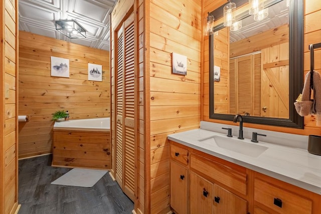 421 Weeks Creek Rd, Blue Ridge, GA 30513 - full bath featuring wood walls, vanity, wood finished floors, a garden tub, and a closet