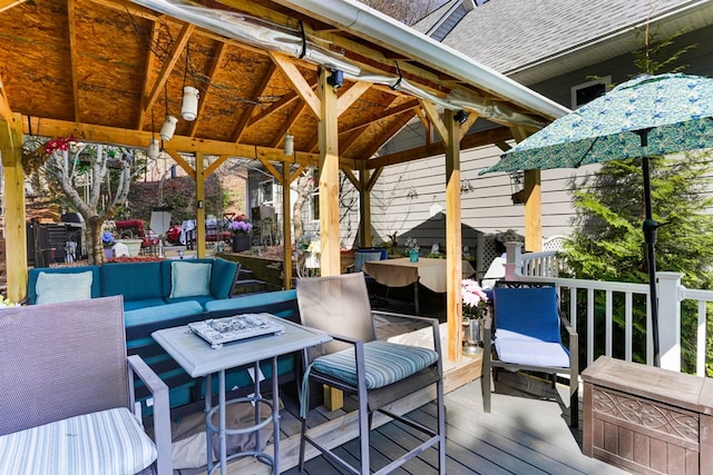 deck featuring a gazebo and an outdoor living space