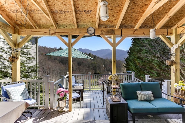 wooden deck with a mountain view