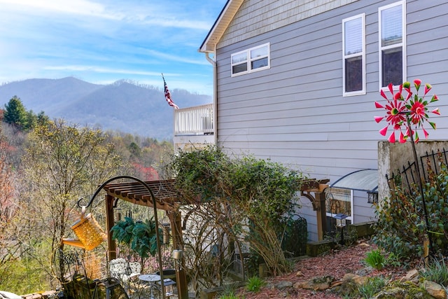 view of home's exterior with a mountain view