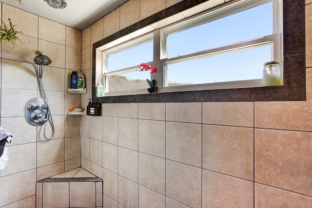 bathroom featuring tiled shower