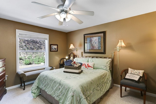 bedroom featuring light colored carpet and ceiling fan