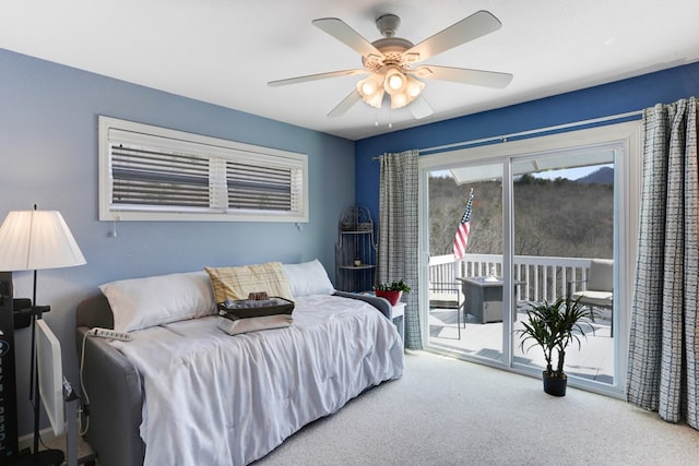 carpeted bedroom with ceiling fan and access to outside