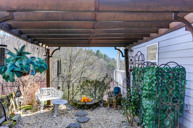 exterior space featuring an outdoor fire pit