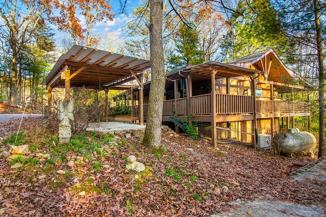 view of home's exterior with a wooden deck