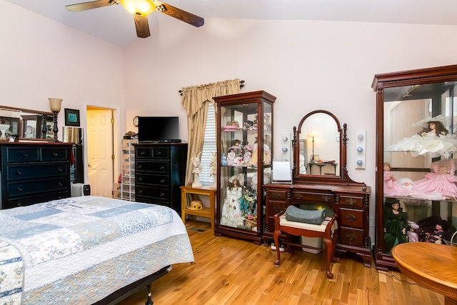 bedroom featuring wood finished floors, ceiling fan, and vaulted ceiling