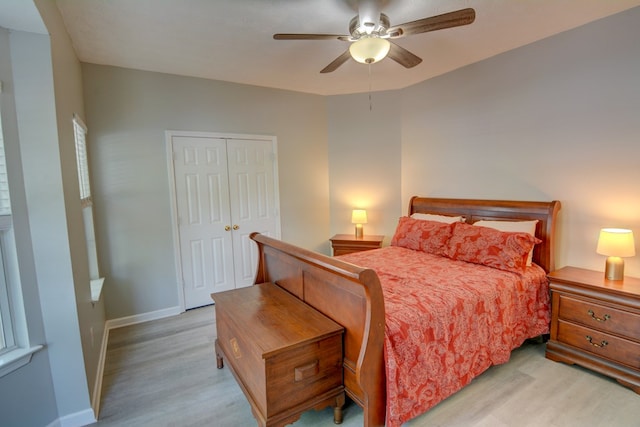 4149 Spring Cove Dr, Duluth, GA 30097 - bedroom featuring light wood finished floors, a closet, baseboards, and ceiling fan