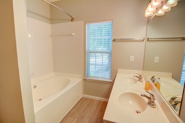 4149 Spring Cove Dr, Duluth, GA 30097 - full bath featuring wood finished floors, bathtub / shower combination, baseboards, and double vanity