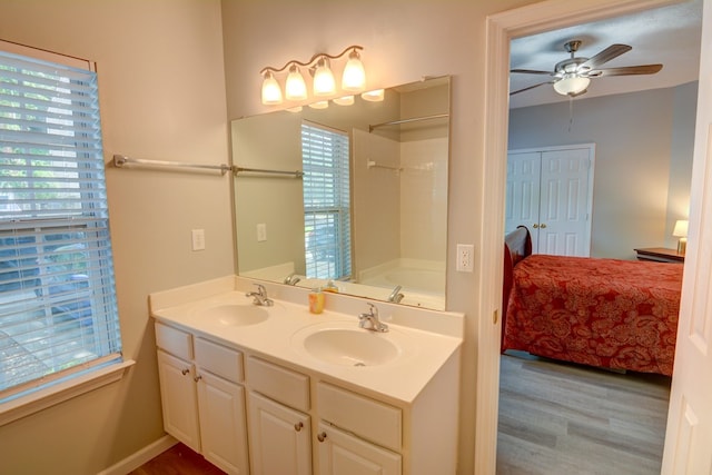 4149 Spring Cove Dr, Duluth, GA 30097 - full bathroom featuring ensuite bathroom, double vanity, wood finished floors, a ceiling fan, and washtub / shower combination