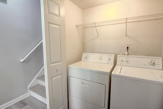4149 Spring Cove Dr, Duluth, GA 30097 - laundry room featuring independent washer and dryer, baseboards, and wood finished floors