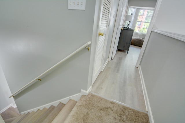 4149 Spring Cove Dr, Duluth, GA 30097 - hall featuring baseboards, wood finished floors, and stairway