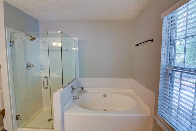 4149 Spring Cove Dr, Duluth, GA 30097 - bathroom featuring a garden tub, a stall shower, and a textured ceiling