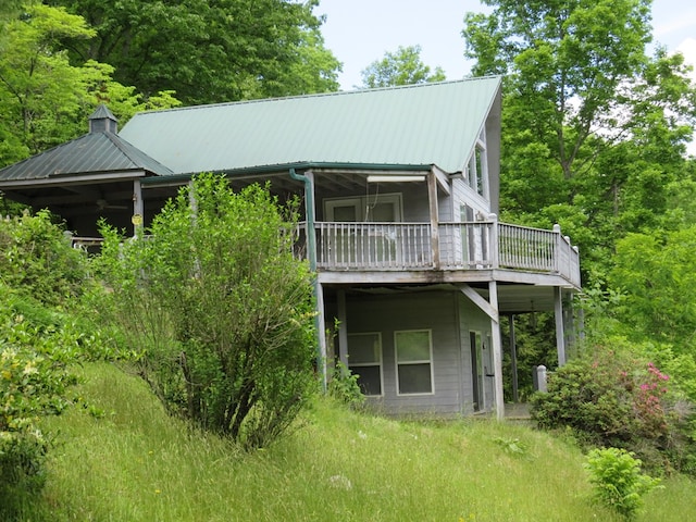 905 Johnson Rd, Hiawassee, GA 30546 - rear view of house featuring a wooden deck and metal roof