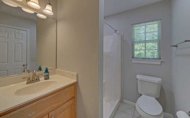 full bathroom with tile patterned flooring, vanity, baseboards, toilet, and a shower with shower curtain
