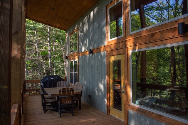 wooden deck with a grill