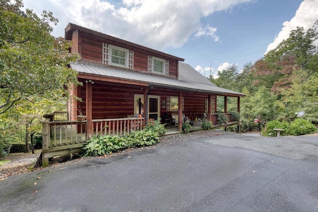 log cabin with covered porch