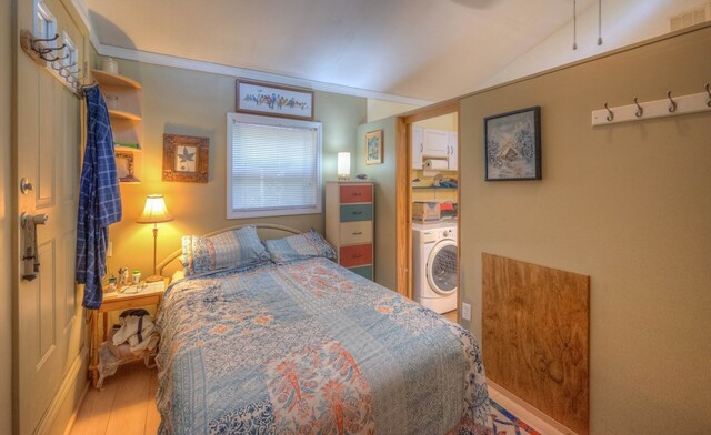 bedroom featuring lofted ceiling and ornamental molding