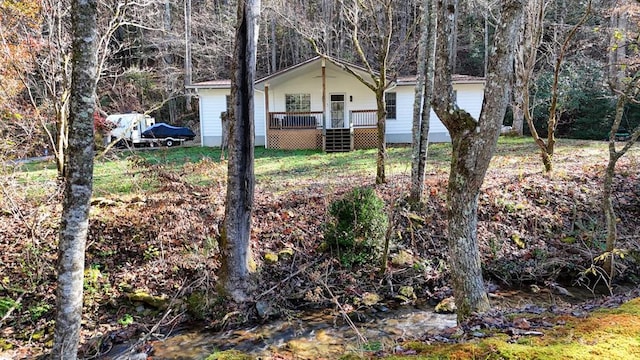 view of yard with covered porch