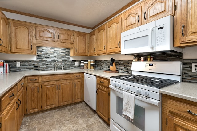 kitchen with sink, tasteful backsplash, and white appliances