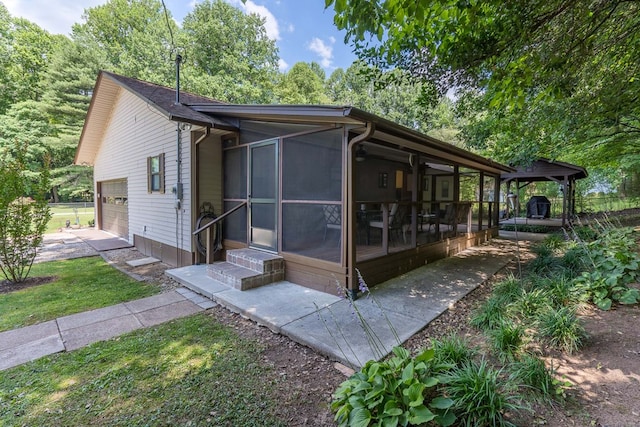 view of front of property featuring a sunroom