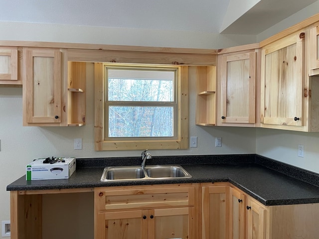 kitchen featuring light brown cabinets and sink