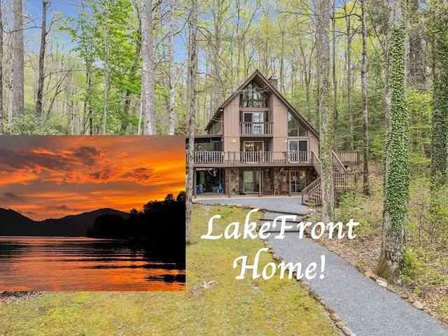 102 Sunset Dr, Topton, NC 28781 - view of front of home with a chimney, stairs, a wooden deck, and a forest view