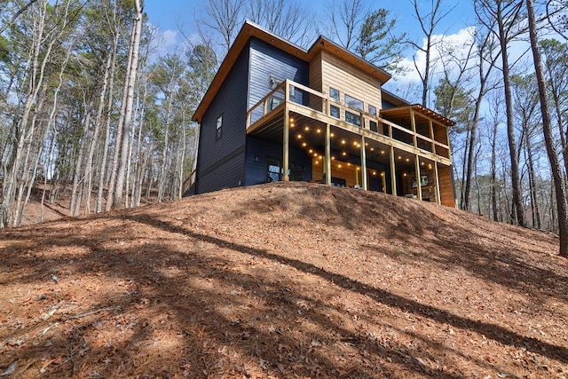 rear view of property featuring a balcony