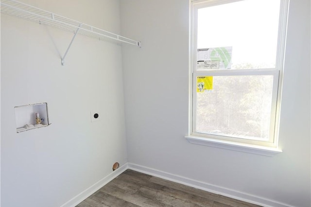 washroom featuring hookup for a washing machine, electric dryer hookup, wood finished floors, and plenty of natural light