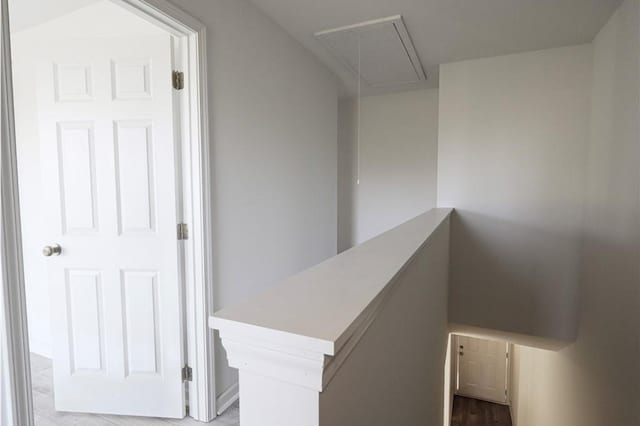 stairway featuring attic access