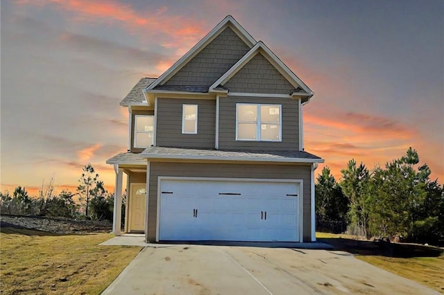 view of front facade featuring a garage and concrete driveway