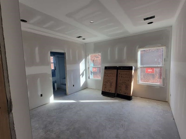 unfurnished bedroom featuring multiple windows