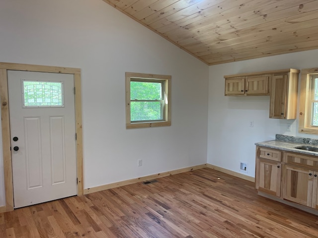 60 Lazy Creek Ln, Murphy, NC 28906 - kitchen featuring vaulted ceiling, light wood-style floors, light brown cabinetry, and wood ceiling