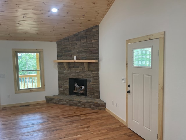 60 Lazy Creek Ln, Murphy, NC 28906 - unfurnished living room featuring vaulted ceiling, wood finished floors, wood ceiling, and a stone fireplace