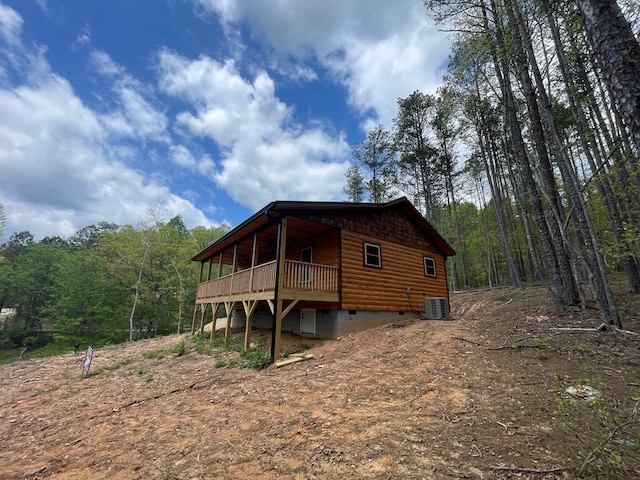 60 Lazy Creek Ln, Murphy, NC 28906 - view of side of home with crawl space, log veneer siding, a deck, and a wooded view