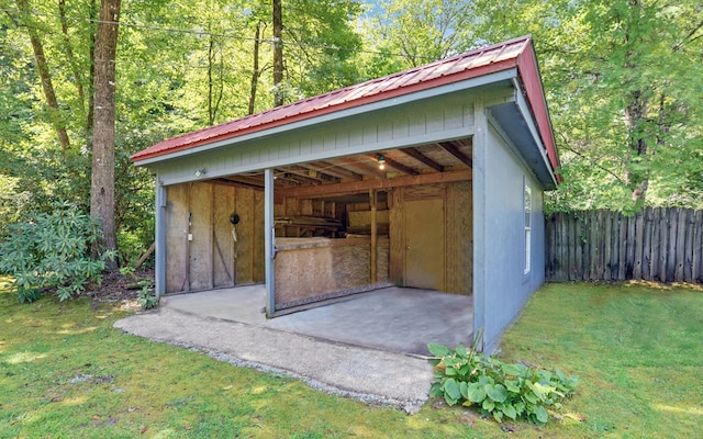 view of outbuilding featuring a yard