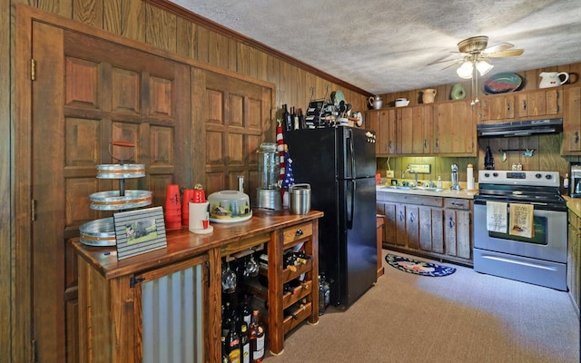 605 W Wildcat, Clarkesville, GA 30523 - kitchen with stainless steel range with electric cooktop, under cabinet range hood, freestanding refrigerator, a sink, and a ceiling fan