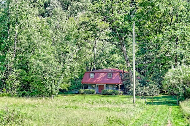 605 W Wildcat, Clarkesville, GA 30523 - view of front of house with a gambrel roof and a forest view