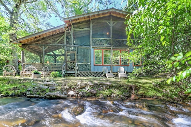 605 W Wildcat, Clarkesville, GA 30523 - back of house featuring a wooden deck and a sunroom